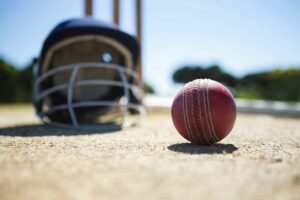 Cricket ball and helmet